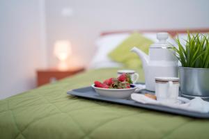 A bed or beds in a room at Green Residence