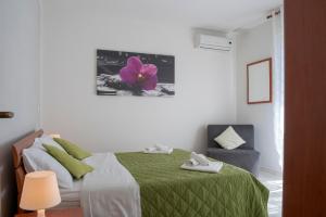 A bed or beds in a room at Green Residence