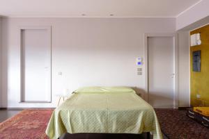 Кровать или кровати в номере Open-Space Macina - Uva Residence
