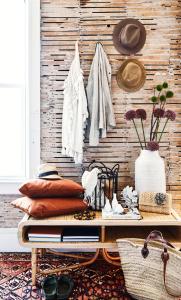 a room with a wooden wall with a table at Block Island Beach House in New Shoreham