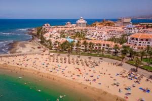 an aerial view of a beach in front of a resort at Parque Santiago III Official in Playa de las Americas