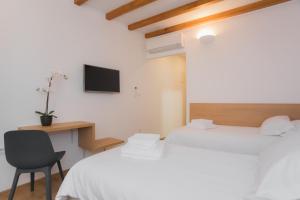 Postel nebo postele na pokoji v ubytování Rooms Kala