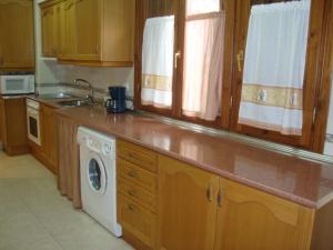 A kitchen or kitchenette at Apartamento Casa Go