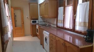 A kitchen or kitchenette at Apartamento Casa Go