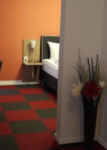 Postel nebo postele na pokoji v ubytování Hotel Luca