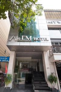 a building with a em hotel sign on it at A&EM - The Petit Hotel in Ho Chi Minh City