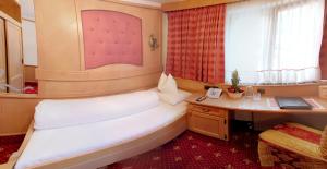 Postel nebo postele na pokoji v ubytování Hotel Purner