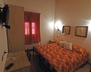 Posteľ alebo postele v izbe v ubytovaní Tenuta La Rosa B&B