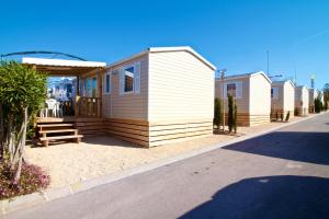 a row of mobile homes on the side of a road at Camping El Torres in Villajoyosa