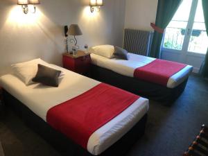 Postelja oz. postelje v sobi nastanitve Hostellerie du Val d'Or