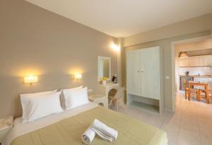 Postel nebo postele na pokoji v ubytování Nancy - Chara Apartments