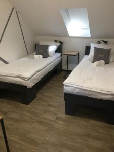 Łóżko lub łóżka w pokoju w obiekcie Kimanoclegi