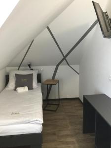 Łóżko lub łóżka w pokoju w obiekcie Kimanoclegi
