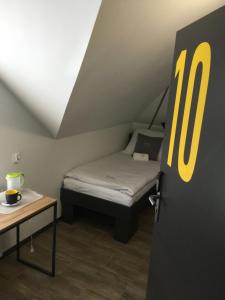 Łóżko lub łóżka w pokoju w obiekcie Kimanoclegi