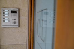 a close up of a microwave oven on a wall at City Lofts in Alexandroupoli