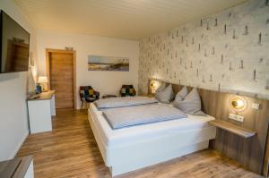 Postel nebo postele na pokoji v ubytování Hotel HaWattn