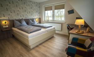 Postel nebo postele na pokoji v ubytování Hotel HaWattn