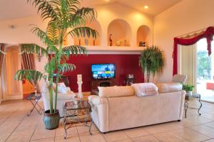 a living room with two couches and a tv at Villa Princess in Cape Coral