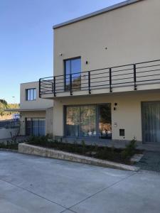 a building with a balcony on the side of it at AREA 19 in Catanzaro