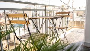 two chairs and a table on a balcony at CconfortHotels R&B Dolci Emozioni in Bari