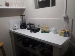 a counter in a kitchen with a blender on it at Hostel Cult MR Alagoas in Arapiraca