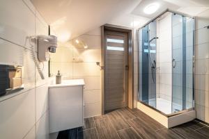 a bathroom with a shower and a sink at Farys in Jastrzębia Góra +40 photos