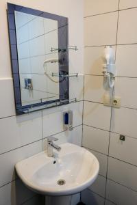 a bathroom with a sink and a mirror at 3 Studio in Tbilisi City