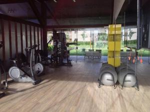 a gym with several exercise equipment in a room at Paraíso Malawí Flat Muro Alto in Porto De Galinhas