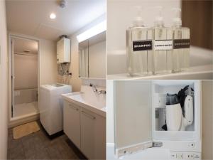 ein weißes Badezimmer mit einem Waschbecken und einem Kühlschrank in der Unterkunft PINN-S1E6 in Sapporo + 46 Fotos