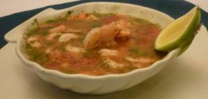 a bowl of soup with shrimp and a lime at The House of the New Boulevard in Quito