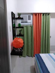 Giường trong phòng chung tại HappyNest 1561 @ Cityland Tagaytay