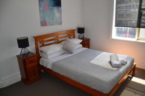 Postel nebo postele na pokoji v ubytování Manly Beach Guesthouse