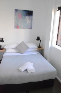 Postel nebo postele na pokoji v ubytování Manly Beach Guesthouse