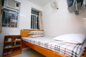 Voodi või voodid majutusasutuse Pay-Less Guesthouse (7/F A9) toas