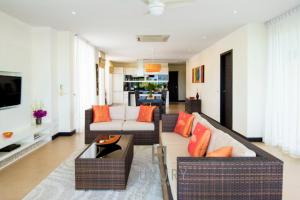 a living room with two couches and a tv at 5 Bedroom Amazing Pool Villa In Resort TS1 in Hua Hin