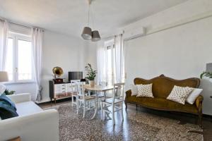 a living room with a couch and a table at BigFamilyFlats - San Giovanni Basilica in Rome
