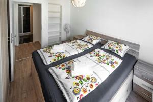 A bed or beds in a room at Old Town Luxury Apartment in heart of Bratislava