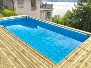 a swimming pool on top of a house at B&B Villa Costanza in Blevio