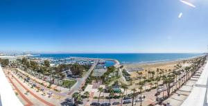 a view of the beach from the balcony of a resort at Sun Hall Hotel in Larnaca