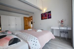 Postel nebo postele na pokoji v ubytování Guesthouse Mila