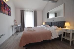 Postel nebo postele na pokoji v ubytování Guesthouse Mila