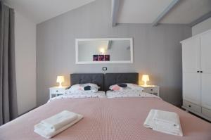 Postel nebo postele na pokoji v ubytování Guesthouse Mila
