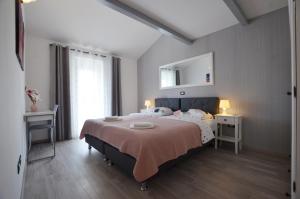 Postel nebo postele na pokoji v ubytování Guesthouse Mila