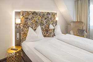 Ένα ή περισσότερα κρεβάτια σε δωμάτιο στο Hotel Menge "An der Schlacht"