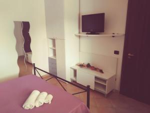 TV a/nebo společenská místnost v ubytování Villa Fontane Bianche
