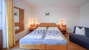 Кровать или кровати в номере Oberbaumgartnerhof