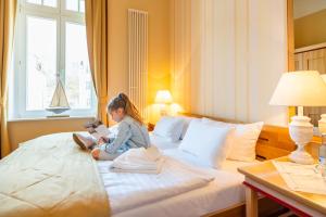 Postel nebo postele na pokoji v ubytování Strandhotel Möwe