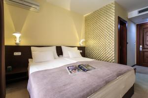 Katil atau katil-katil dalam bilik di Hotel Premier
