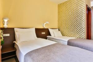 Katil atau katil-katil dalam bilik di Hotel Premier