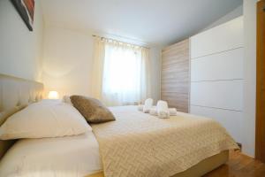 Posteľ alebo postele v izbe v ubytovaní Apartment Nicol